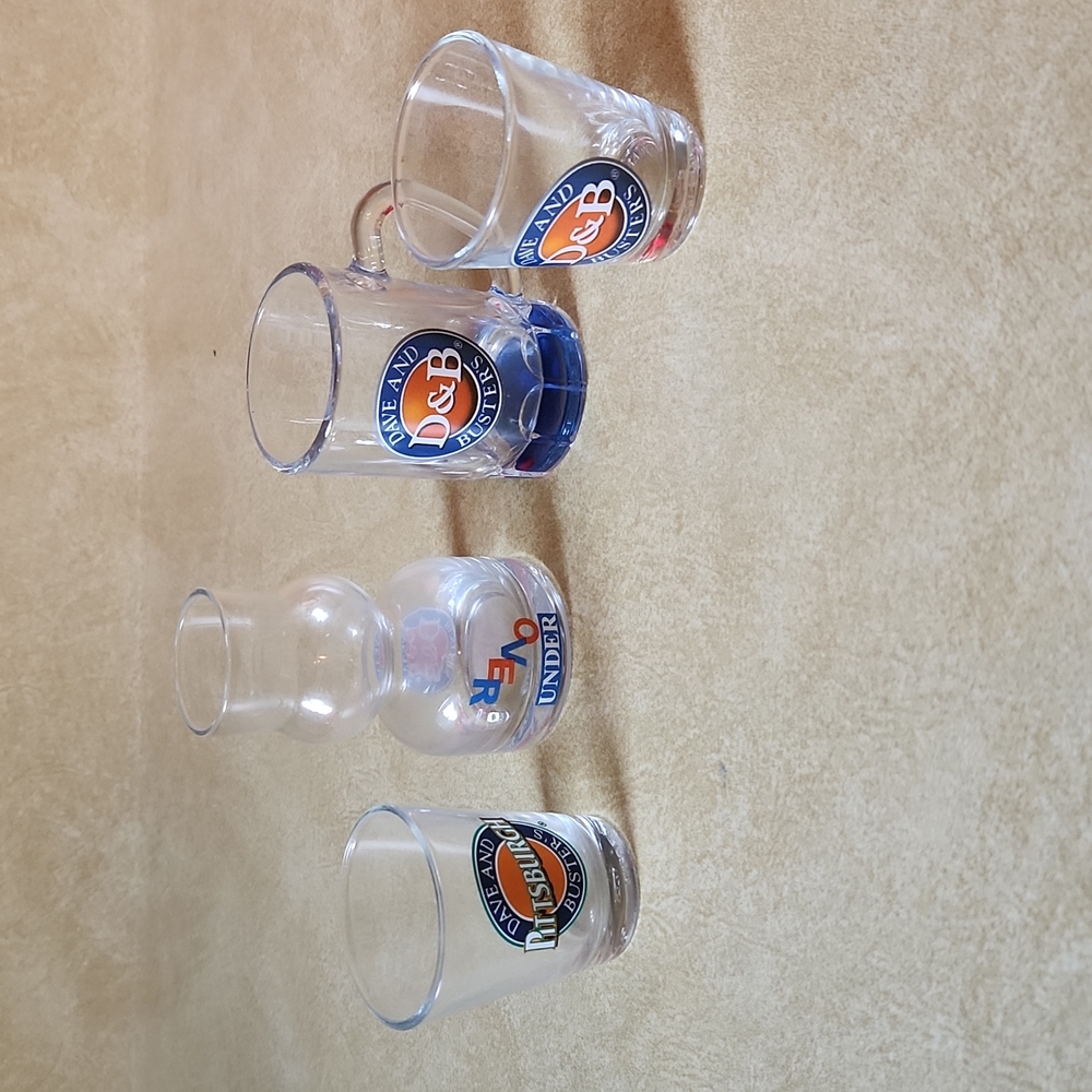 Set of 4 Dave and Buster's shot glasses, never used just collected.